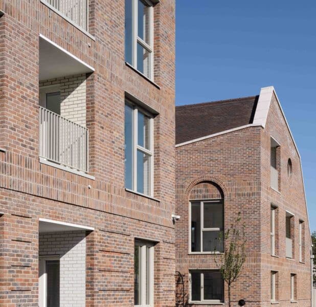 Becontree Avenue, Dagenham: detail of brick gable end with pitched roof and arched entry, completed Be First / LBBD scheme