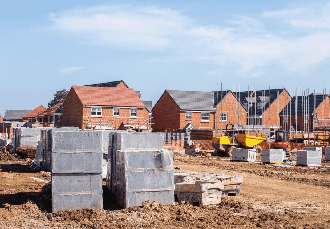 Glenvale Park under construction: concrete foundations and partly-built homes with site machinery