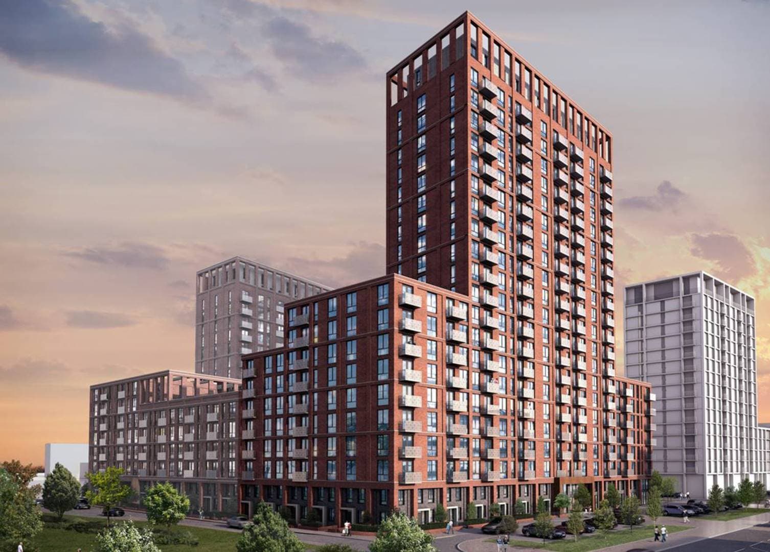 Outwood Wharf Phase 2, Salford: render of a 23-storey red-brick BTR tower above a podium block, with grid-pattern balconies and crown frame against a sunset sky, Ridgeback / ila scheme